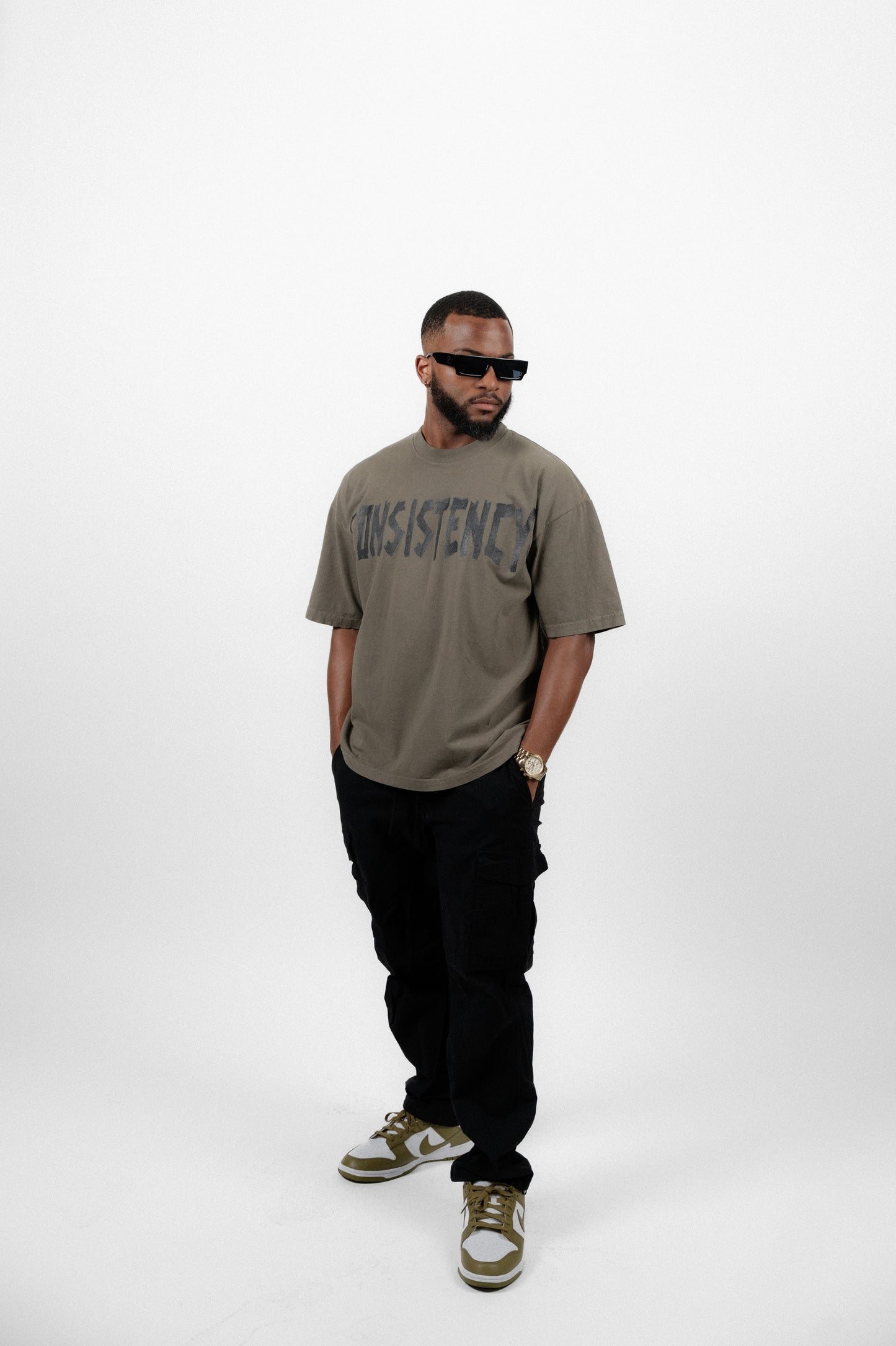 "CONSISTENCY" TAPE TEE